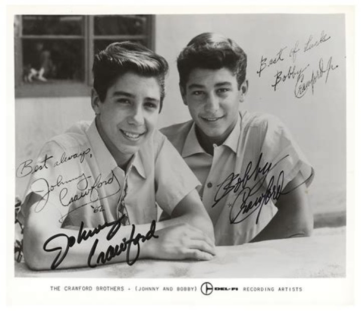 Johnny Crawford in 1997 with a photo of himself as a boy and Chuck